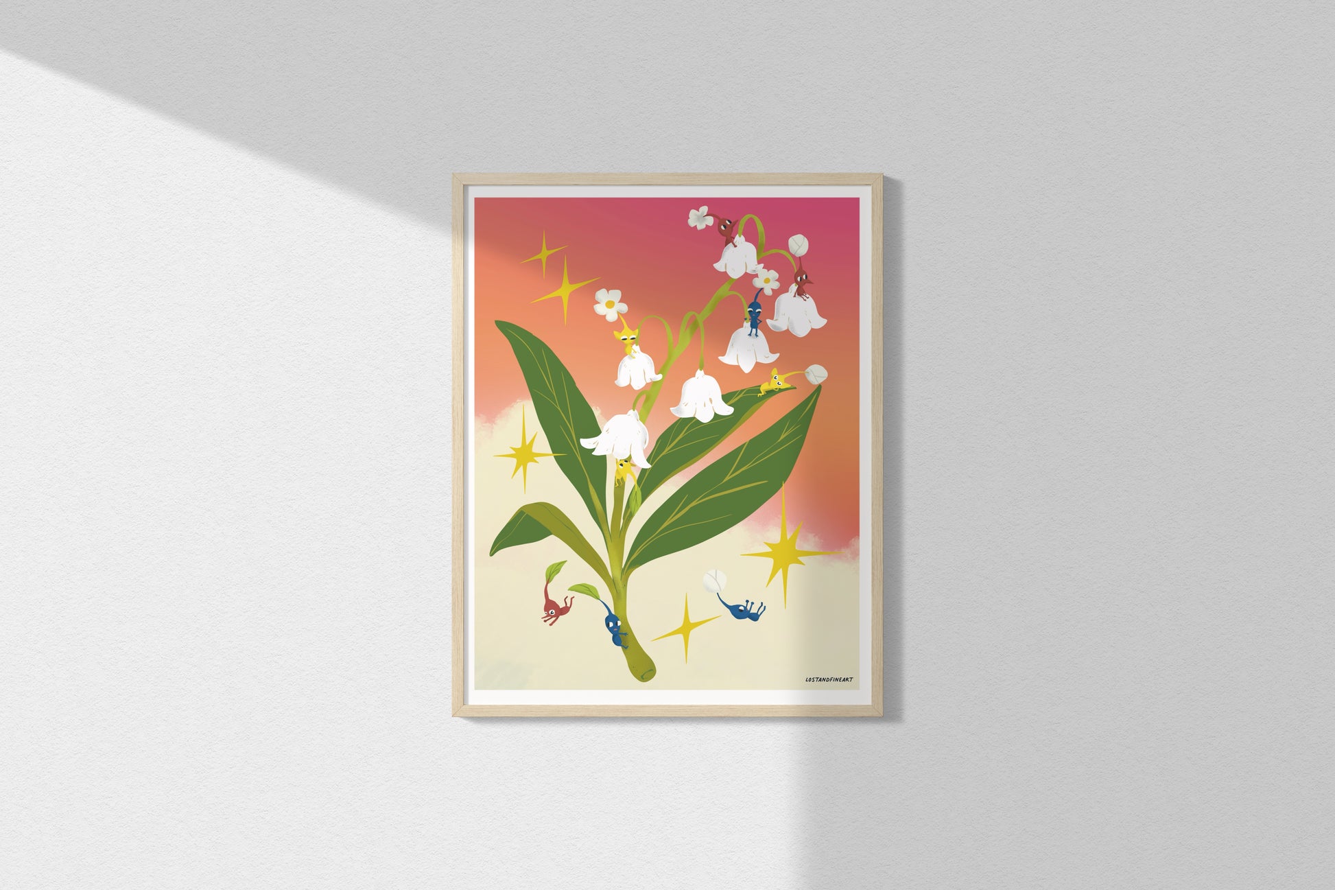 Framed artwork of a floral design with a colorful background on a white wall.